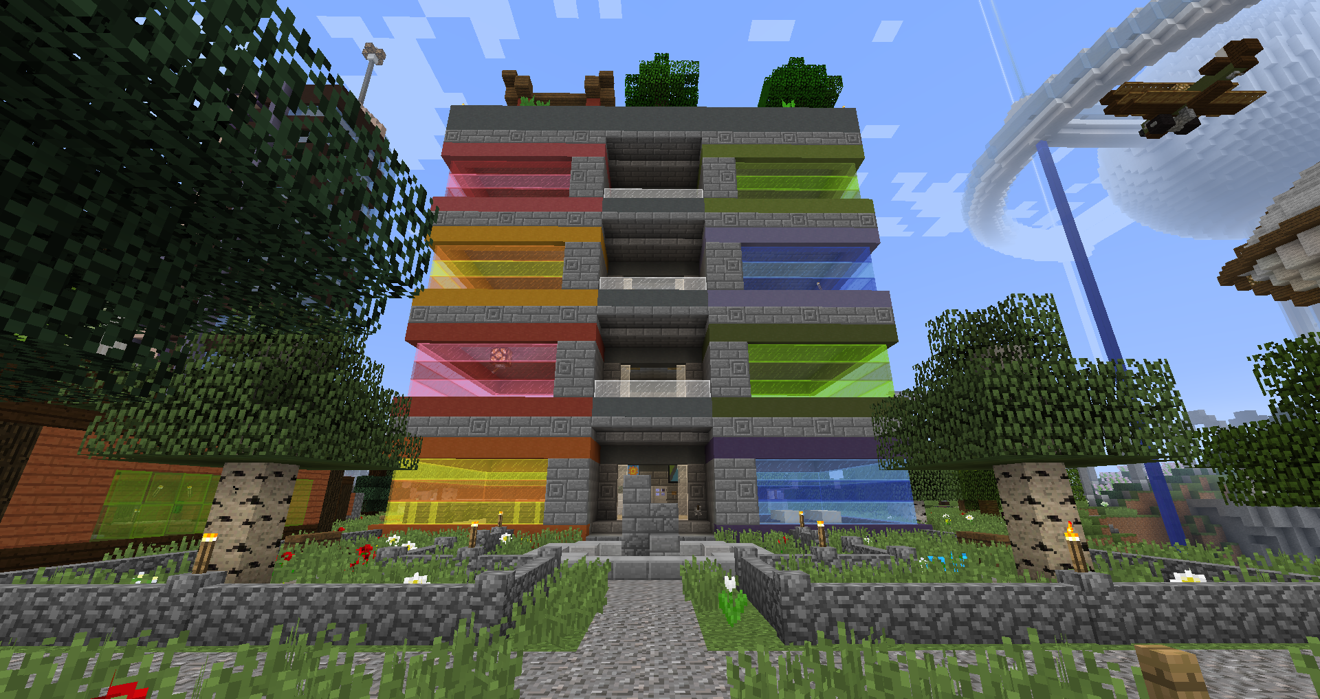Rainbow-coloured tower of suites in Minecraft